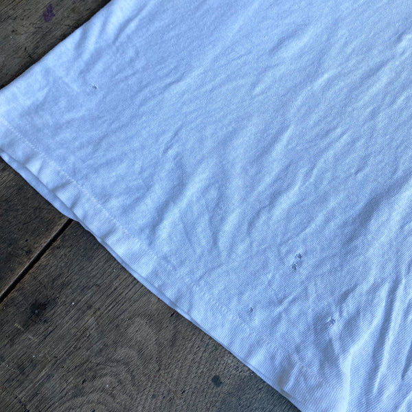 Load image into Gallery viewer, Vintage White T on wooden table