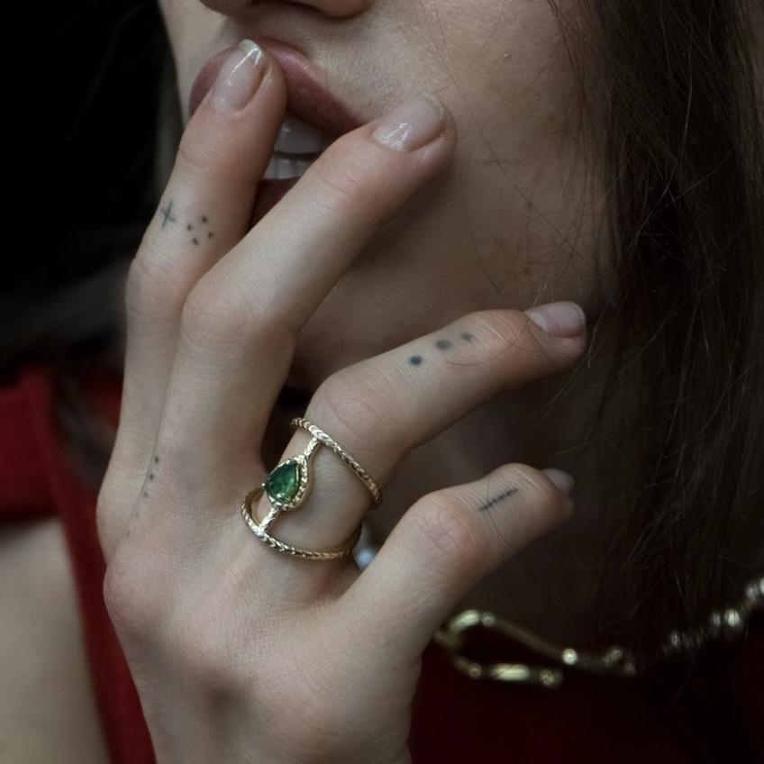 Load image into Gallery viewer, 14k yellow gold ring with emerald on hand against womans face