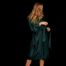 Load image into Gallery viewer, Girl with Blonde Hair wearing a Green Silk Kimono Robe looking down tying her belt
