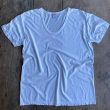 Load image into Gallery viewer, White T shirt on wooden table
